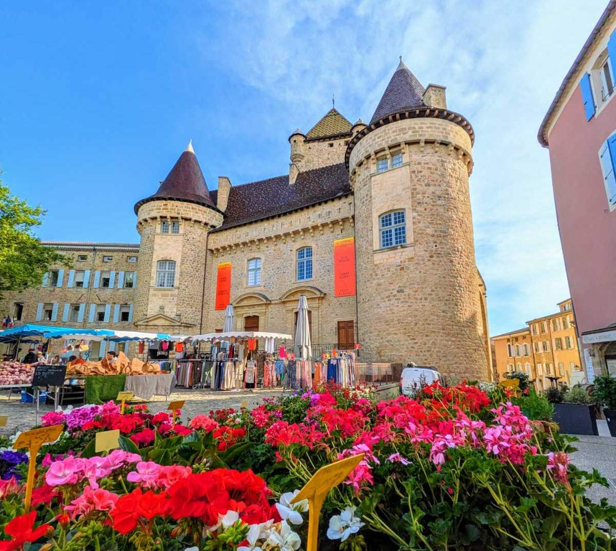 Aubenas market in the Place du Château with flowers and shops